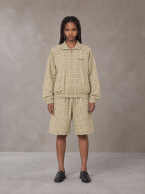 Model wearing the SM Meridian Shorts in Ecru, front view.