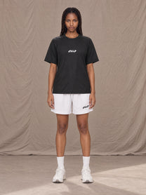 Model wearing the SM Motion Mesh Shorts in Lucent White, front view.
