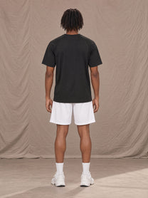 Model wearing the SM Motion Mesh Shorts in Lucent White, rear view.