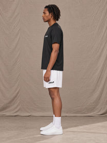 Model wearing the SM Motion Mesh Shorts in Lucent White, side profile.