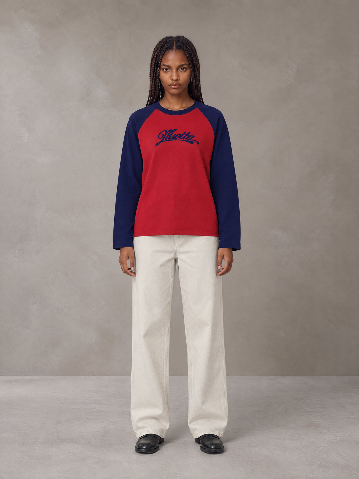 Model wearing SM Retro Raglan Long-Sleeve T-shirt in Crimson, front view.