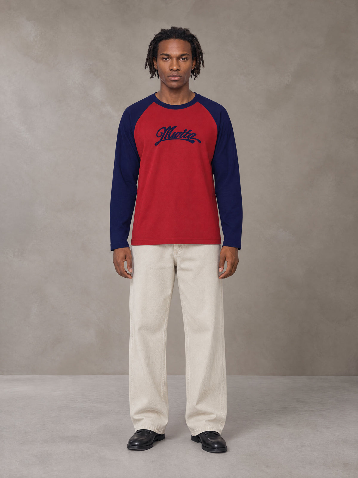 Model wearing SM Retro Raglan Long-Sleeve T-shirt in Crimson, front view.