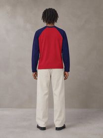 Model wearing SM Retro Raglan Long-Sleeve T-shirt in Crimson, rear view.