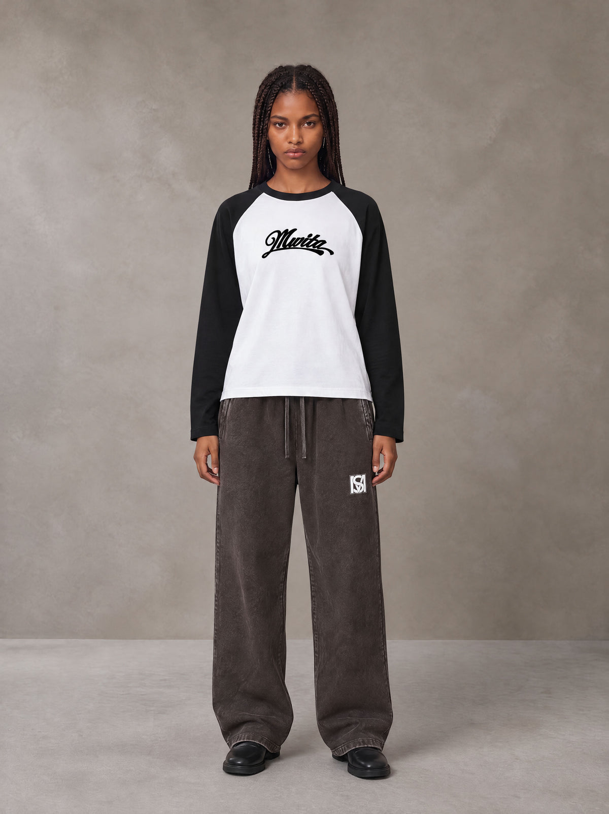 Model wearing SM Retro Raglan Long-Sleeve T-shirt in Lucent White, front view.