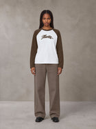 Model wearing SM Retro Raglan Long-Sleeve T-shirt in Lucent White, front view.