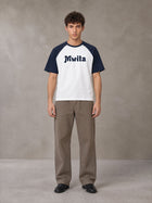 Model wearing SM Retro Raglan T-shirt in Oxford Navy, front view.
