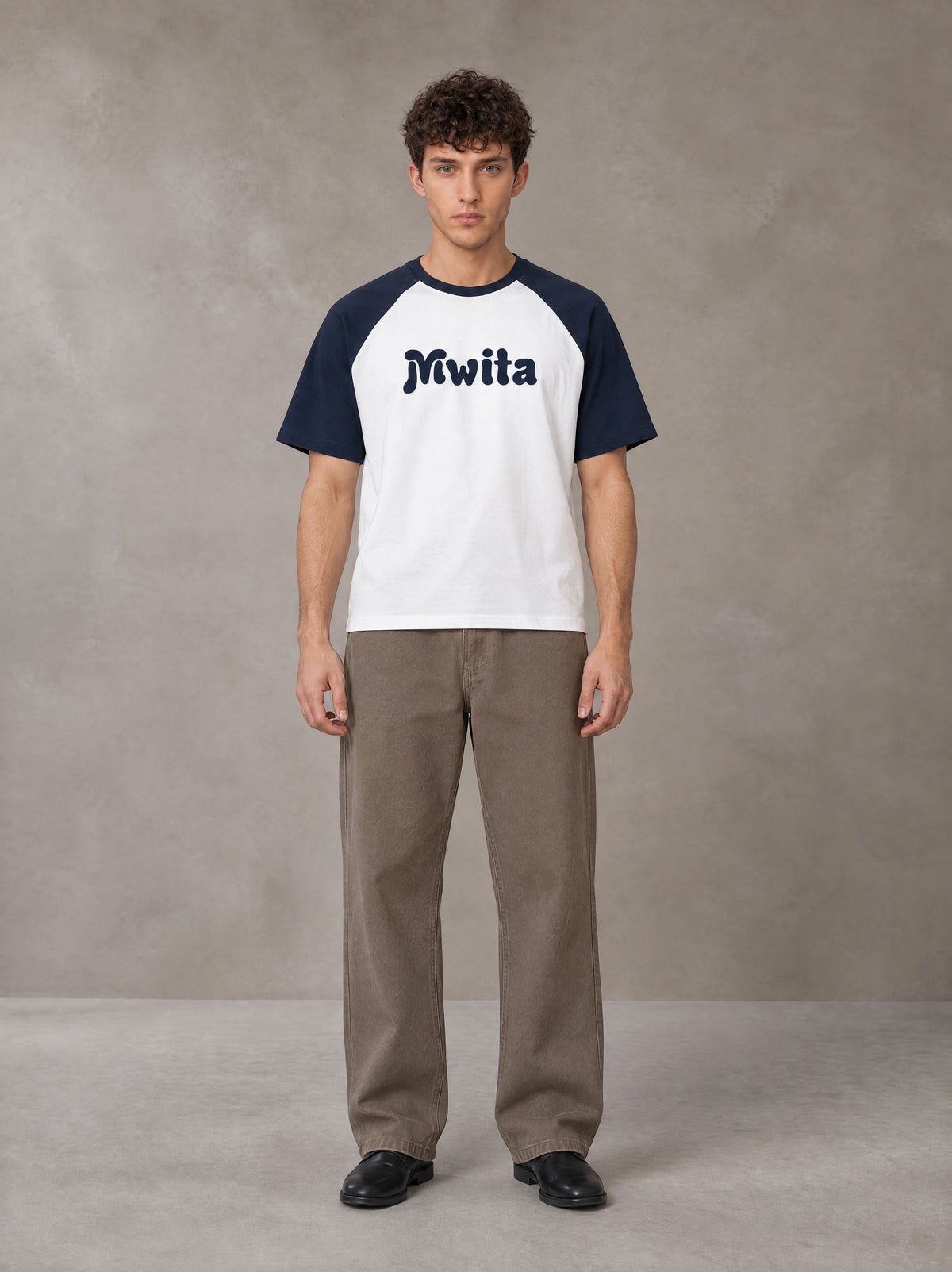 Model wearing SM Retro Raglan T-shirt in Oxford Navy, front view.