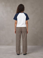Model wearing SM Retro Raglan T-shirt in Oxford Navy, rear view.