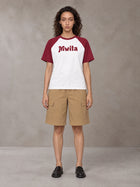 Model wearing SM Retro Raglan T-shirt in Burgundy, front view.