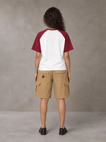 Model wearing SM Retro Raglan T-shirt in Burgundy, rear view.