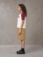 Model wearing SM Retro Raglan T-shirt in Burgundy, side profile.