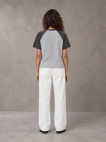 Model wearing SM Retro Raglan T-shirt in Deep Charcoal, rear view.