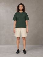 Model wearing SM Sig. Earth T-shirt in Alpine Green, front view.