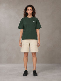 Model wearing SM Sig. Earth T-shirt in Alpine Green, front view.