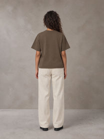 Model wearing SM Sig. Earth T-shirt in Brown, rear view.