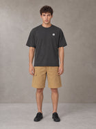 Model wearing SM Sig. Earth T-shirt in Deep Charcoal, front view.