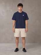 Model wearing SM Sig. Earth T-shirt in Oxford Navy, front view.