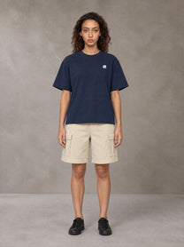 Model wearing SM Sig. Earth T-shirt in Oxford Navy, front view.
