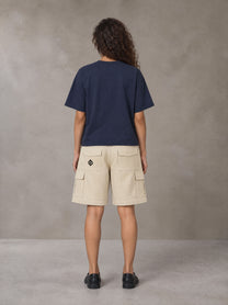 Model wearing SM Sig. Earth T-shirt in Oxford Navy, rear view.