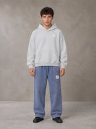 Model wearing SM Sig. Fleece Hoodie in Floral Grey, front view.