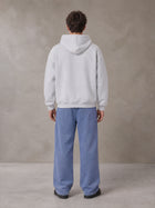 Model wearing SM Sig. Fleece Hoodie in Floral Grey, rear view.