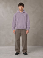 Model wearing SM Sig. Fleece Hoodie in Soft Lavender, front view.