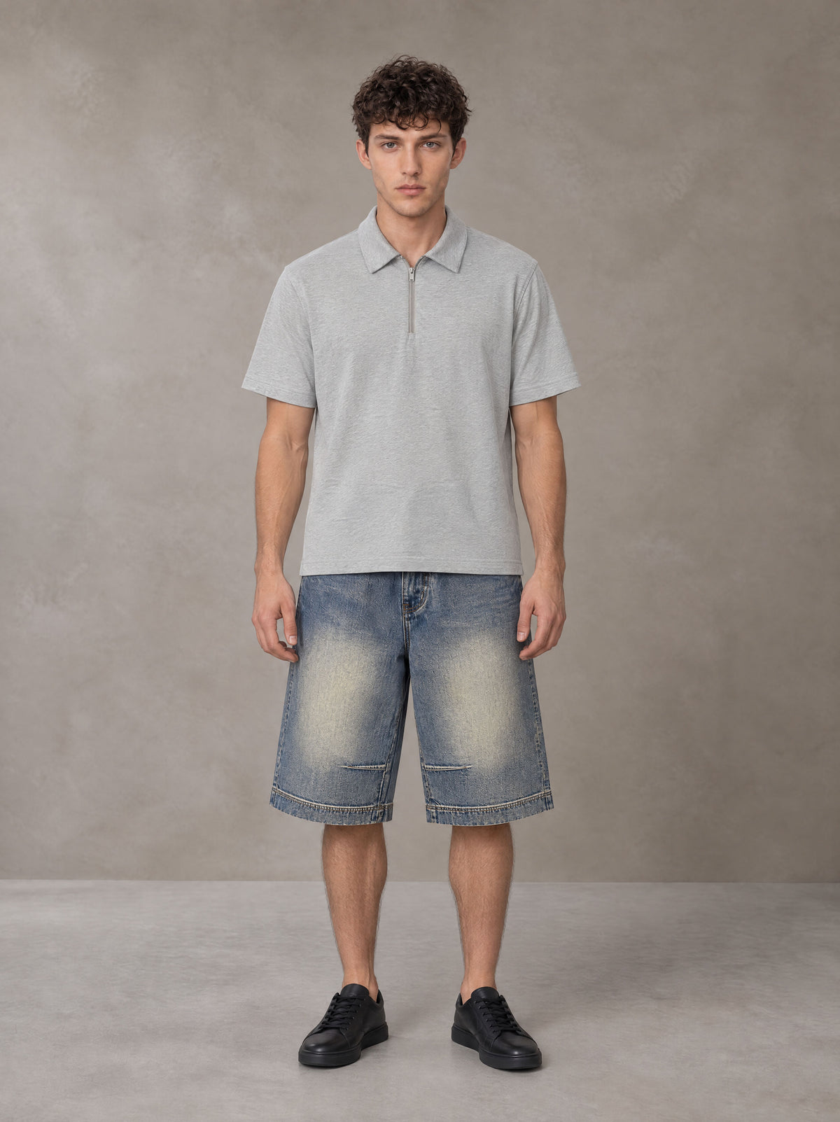 Model wearing SM Sig. Half-Zip Polo Shirt in Floral Grey, front view.