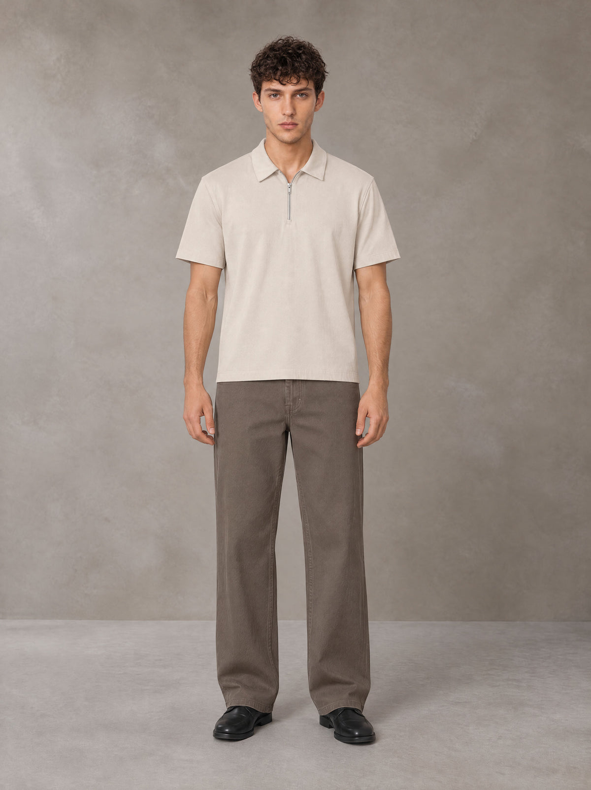 Model wearing SM Sig. Half-Zip Polo Shirt in Oatmeal Cookie, front view.