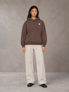 Model wearing SM Sig. High Neck Fleece Hoodie in Brown, front view.