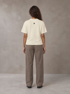 Model wearing SM Sig. Knitted Round Neck T-shirt in Neutral Heather, rear view.