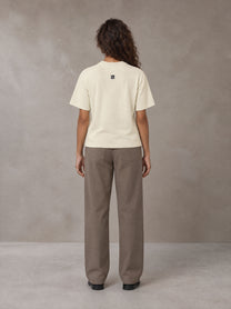 Model wearing SM Sig. Knitted Round Neck T-shirt in Neutral Heather, rear view.
