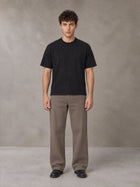 Model wearing SM Sig. Knitted Round Neck T-shirt in Midnight Black, front view.