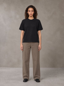 Model wearing SM Sig. Knitted Round Neck T-shirt in Midnight Black, front view.