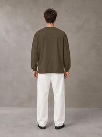 Model wearing SM Sig. Long Sleeve T-shirt in Brown, rear view.