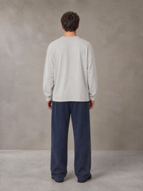 Model wearing SM Sig. Long Sleeve T-shirt in Pure Grey, rear view.