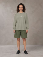 Model wearing SM Sig. Long Sleeve T-shirt in Stone Grey, front view.