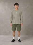 Model wearing SM Sig. Long Sleeve T-shirt in Stone Grey, front view.