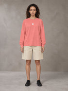 Model wearing SM Sig. Long Sleeve T-shirt in Watermelon Tint, front view.