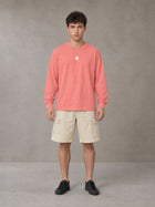 Model wearing SM Sig. Long Sleeve T-shirt in Watermelon Tint, front view.