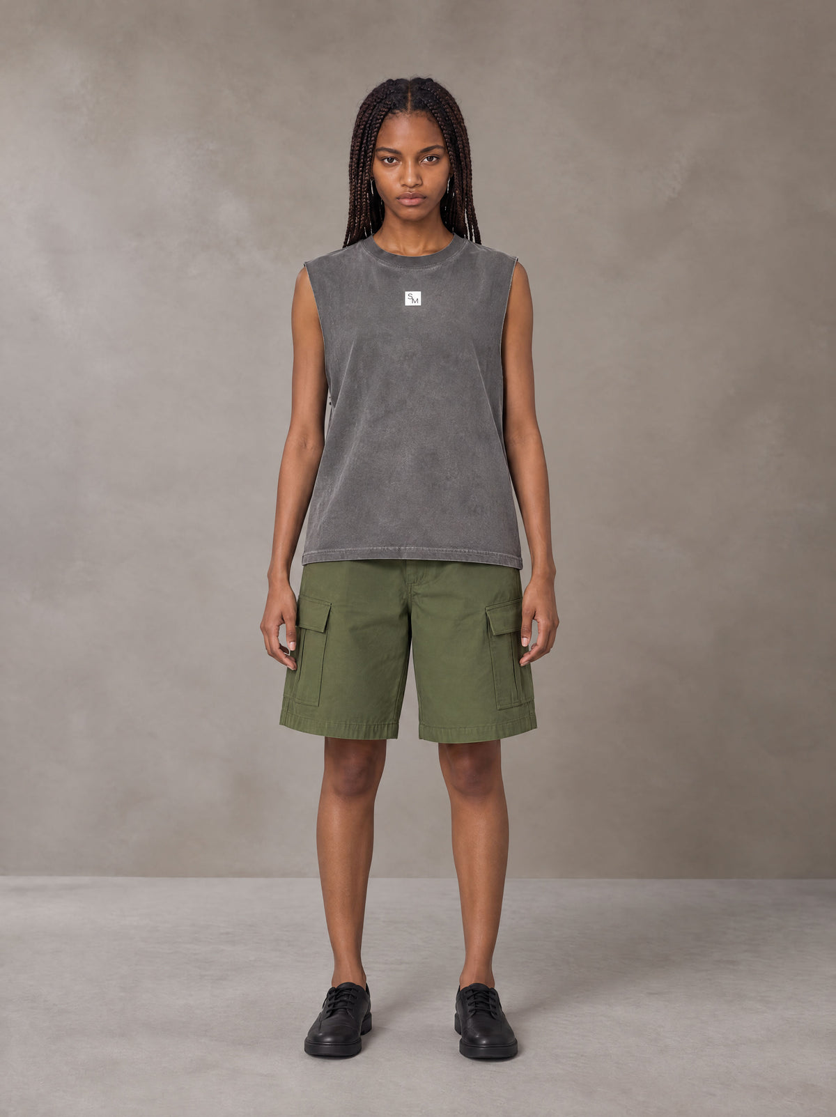 Model wearing SM Sig. Reverse Washed Tank Top in Pure Grey, front view.