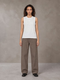 Model wearing SM Sig. Sleeveless Tank Top in Ivory White, front view.