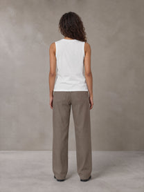 Model wearing SM Sig. Sleeveless Tank Top in Ivory White, rear view.