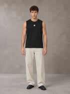 Model wearing SM Sig. Sleeveless Tank Top in Midnight Black, front view.