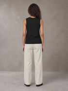 Model wearing SM Sig. Sleeveless Tank Top in Midnight Black, rear view.