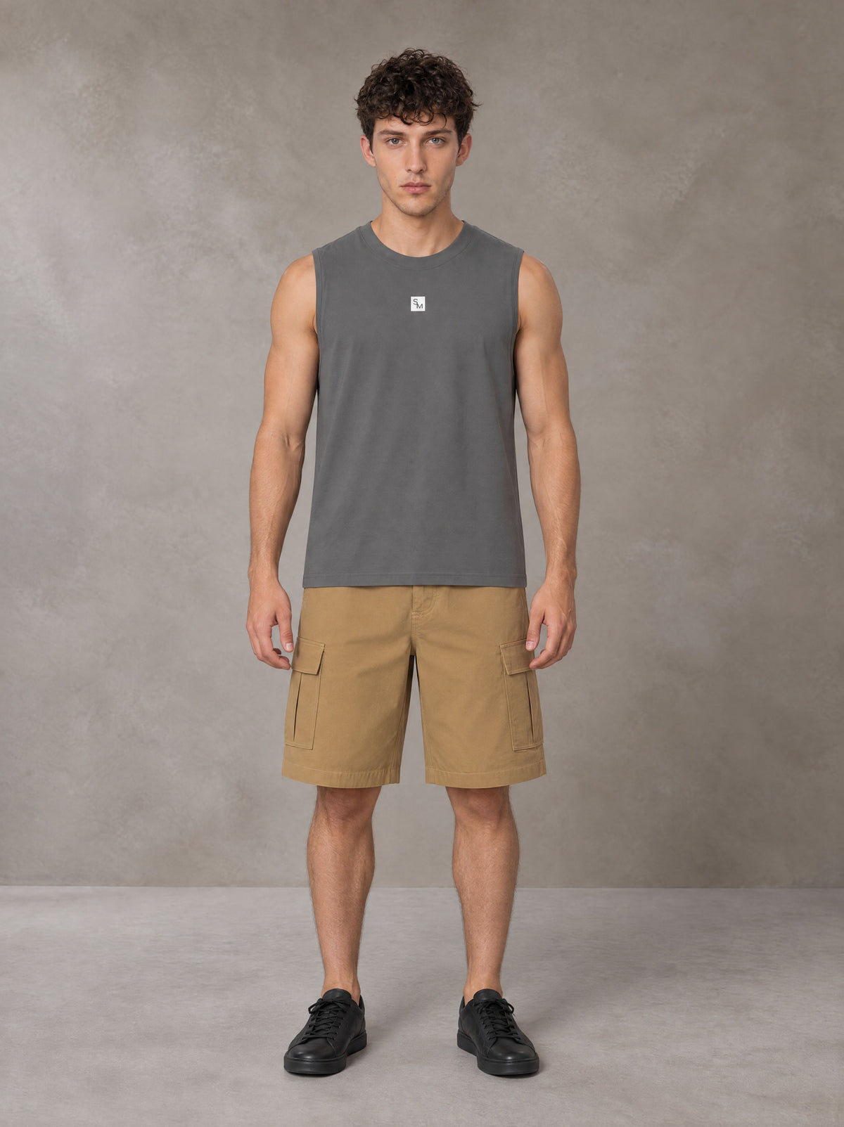 Model wearing SM Sig. Sleeveless Tank Top in Pure Grey, front view.