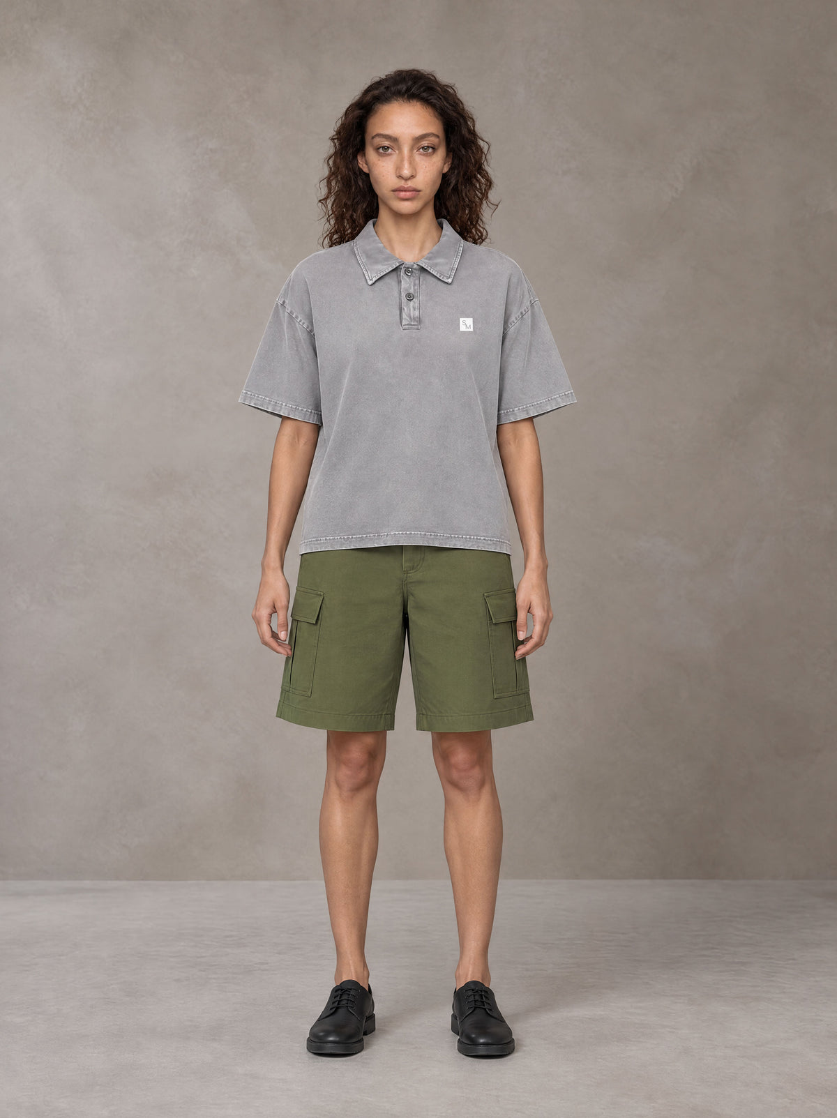 Model wearing SM Sig. Snow Washed Polo T-shirt in Polished Silver, front view.