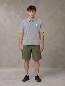 Model wearing SM Sig. Snow Washed Polo T-shirt in Polished Silver, front view.