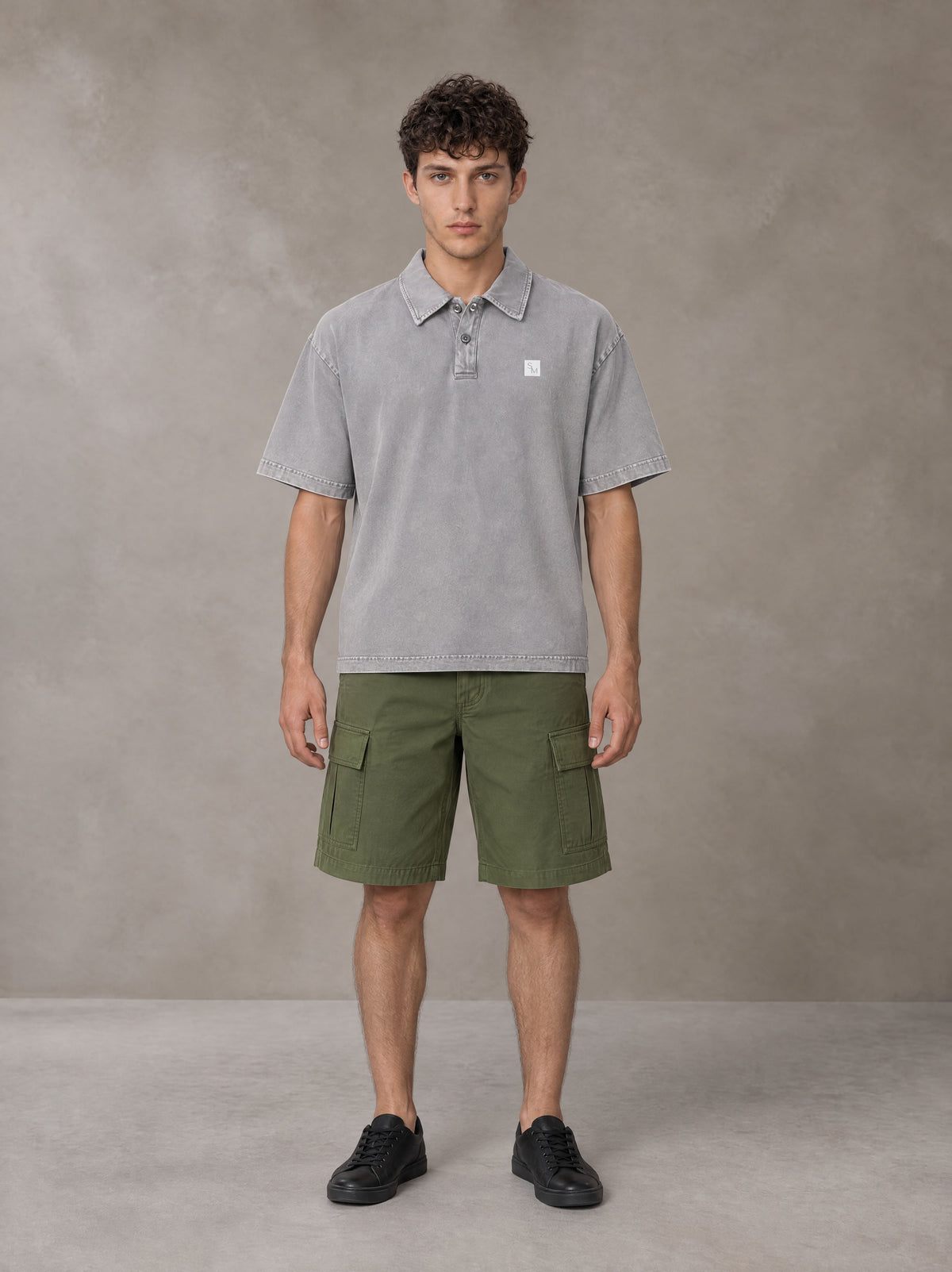 Model wearing SM Sig. Snow Washed Polo T-shirt in Polished Silver, front view.