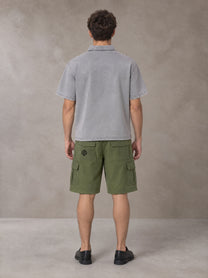 Model wearing SM Sig. Snow Washed Polo T-shirt in Polished Silver, rear view.