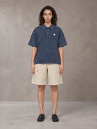 Model wearing SM Sig. Snow Washed Polo T-shirt in Oxford Navy, front view.